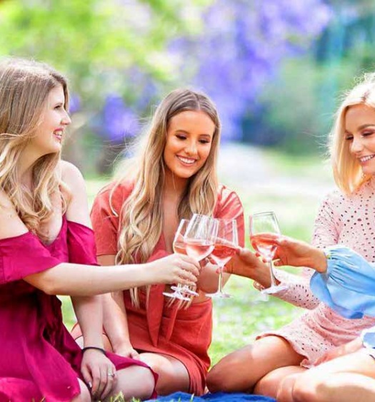 4 ladies enjoying wine tasting outdoors at Hampton Estate Wines