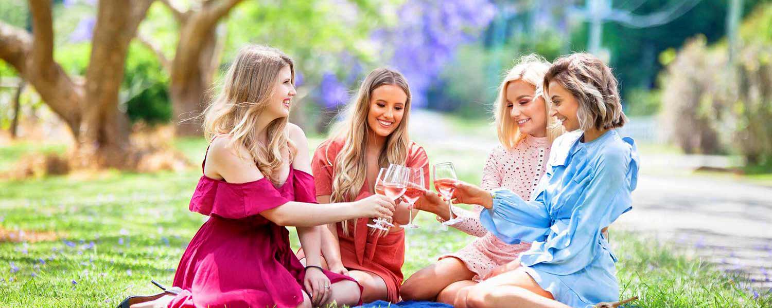 4 ladies enjoying wine tasting outdoors at Hampton Estate Wines